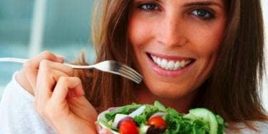 woman eating salad