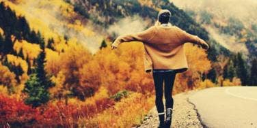 girl standing by the road