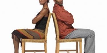 woman and man in back to back chairs