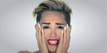 Miley Cyrus naked and crying in her "Wrecking Ball" music video Miley Cyrus naked and crying in her "Wrecking Ball" music video