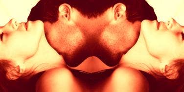 man kissing woman's neck man kissing woman's neck