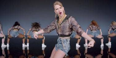 Taylor Swift looking obnoxious in her "Shake It Off" music video from the album "1989" Taylor Swift looking obnoxious in her "Shake It Off" music video from the album "1989"