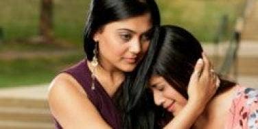 woman comforting crying woman