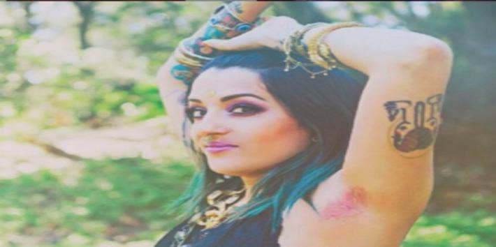 Woman with pink underarm hair.