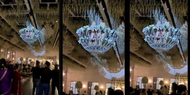 Video Of Bride’s ‘Dangerous’ Wedding Entrance In A Chandelier Gets Mixed Reactions