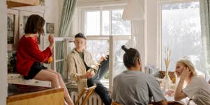 group of friends hanging out, girl playfully flirting