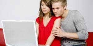 Couple looking at laptop screen
