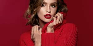 woman in sweater and red lipstick