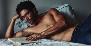 smart man reading in bed