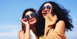 two girl friends wearing sunglasses