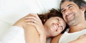 happy couple lying in bed