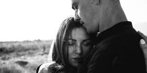 man and woman hugging