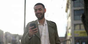 man texting on the street