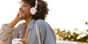 Woman smiling listening to music 