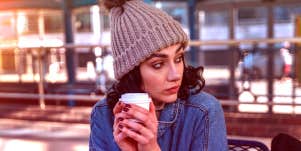 woman sitting outside with coffee