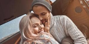 man and woman cuddling