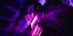 woman in purple dark light