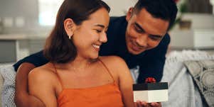 man giving girlfriend a present