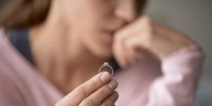 woman holding wedding ring