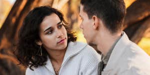 man and woman talking