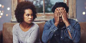 unhappy couple sitting together