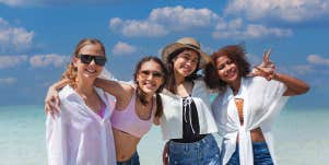 4 women at a beach