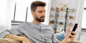 man texting on phone