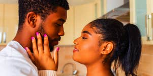 woman holding man close