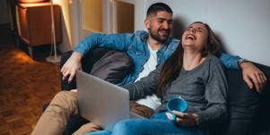 man and woman laughing