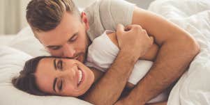 couple cuddling in bed