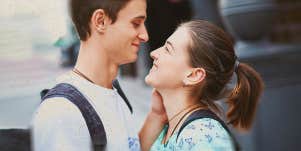 young couple smiling on each other