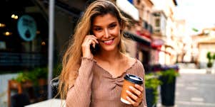confident young woman holding coffee