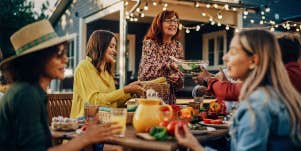 friends having dinner party outside
