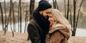 man hugging woman
