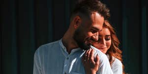 woman hugging man from behind