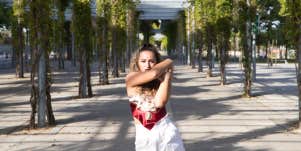 latina woman standing outside