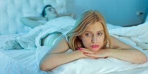 unhappy woman in bed