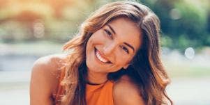 woman smiling and tilting her head