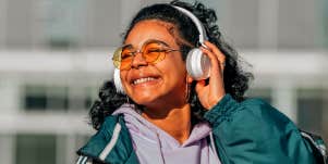 happy smiling woman listening to headphones
