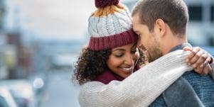 man and woman hugging