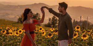 couple dancing in sunflower field