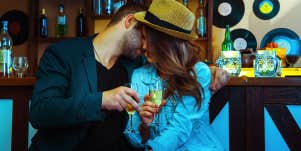 man flirting with woman at bar