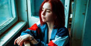 woman sitting by window