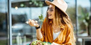 healthy woman eating salad