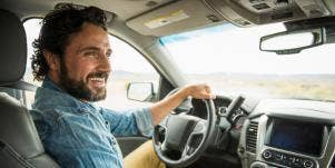 man in car driving