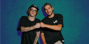 Two men fist bump