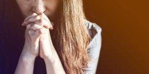 Distraught woman praying