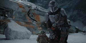 Scene from "The Mandalorian" of Mando and Grogu