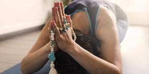 woman with hands in prayers