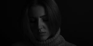 serious woman in dark